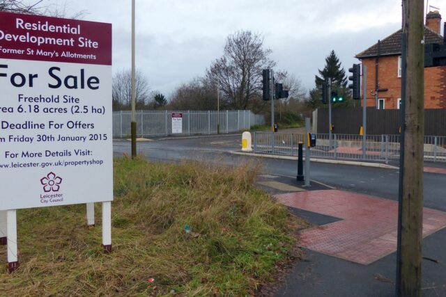A UK for sale sign in front of a property