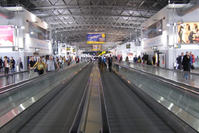 Interior of Brussels Airport terminal with check-in desks and passenger areas