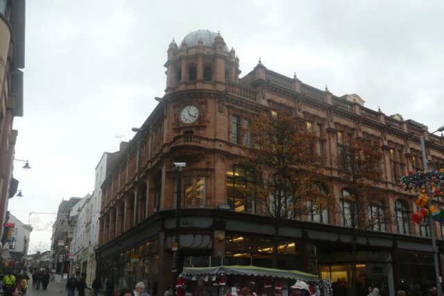 Historic Boots building on Nottingham High Street, a red brick structure completed in 1902-3