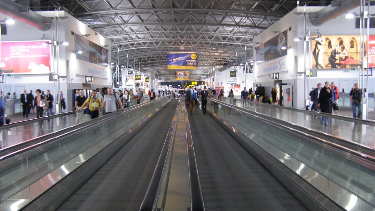 Interior of Brussels Airport terminal with check-in counters and passenger area