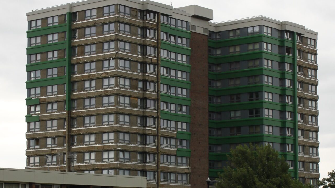 Tower block in Sheffield with exterior cladding panels removed for inspection
