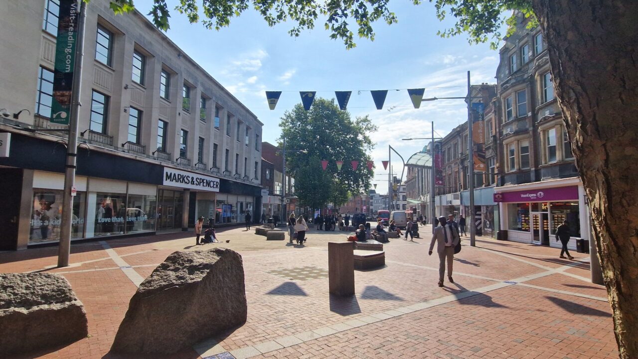 Broad Street in Reading with Marks & Spencer store frontage visible on the left side of the shopping street.