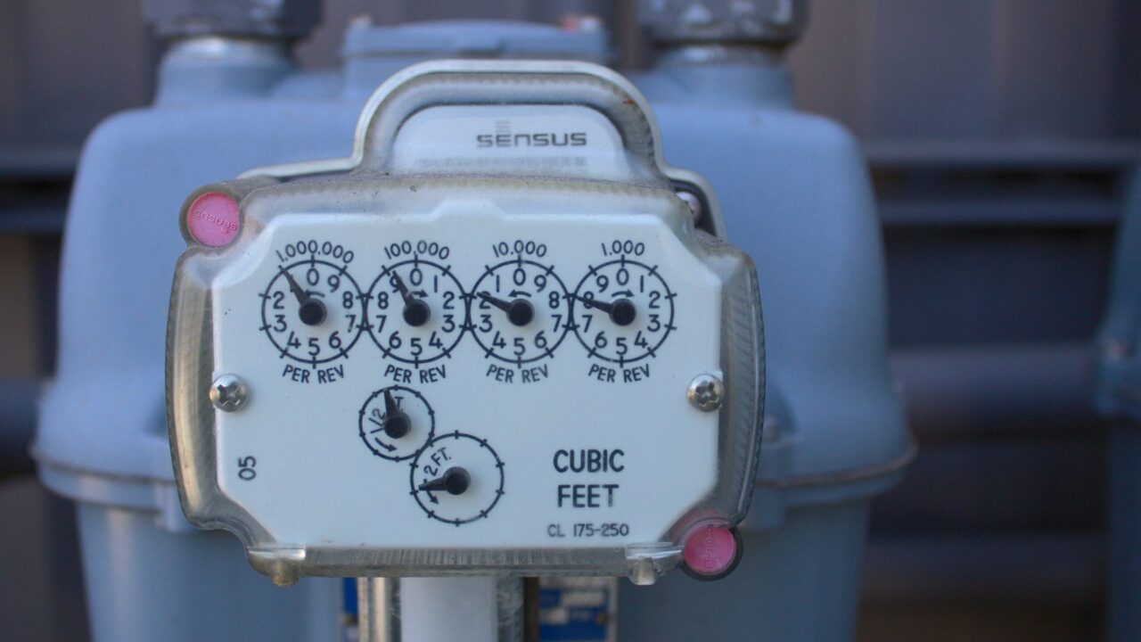 Close-up of a utility meter mounted on a pole