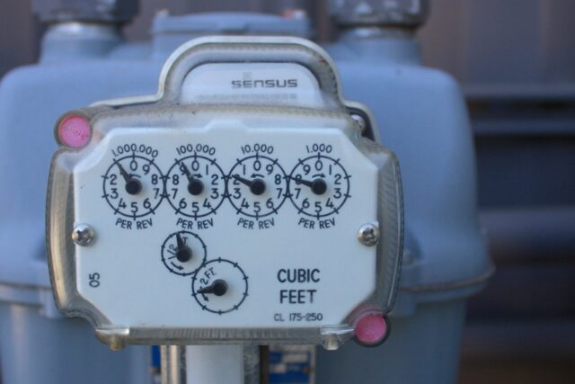 Close-up of a utility meter mounted on a pole