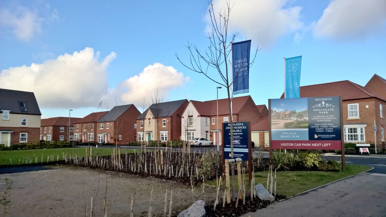 New residential estate with multiple modern houses under construction at Hollygate Park, Cotgrave