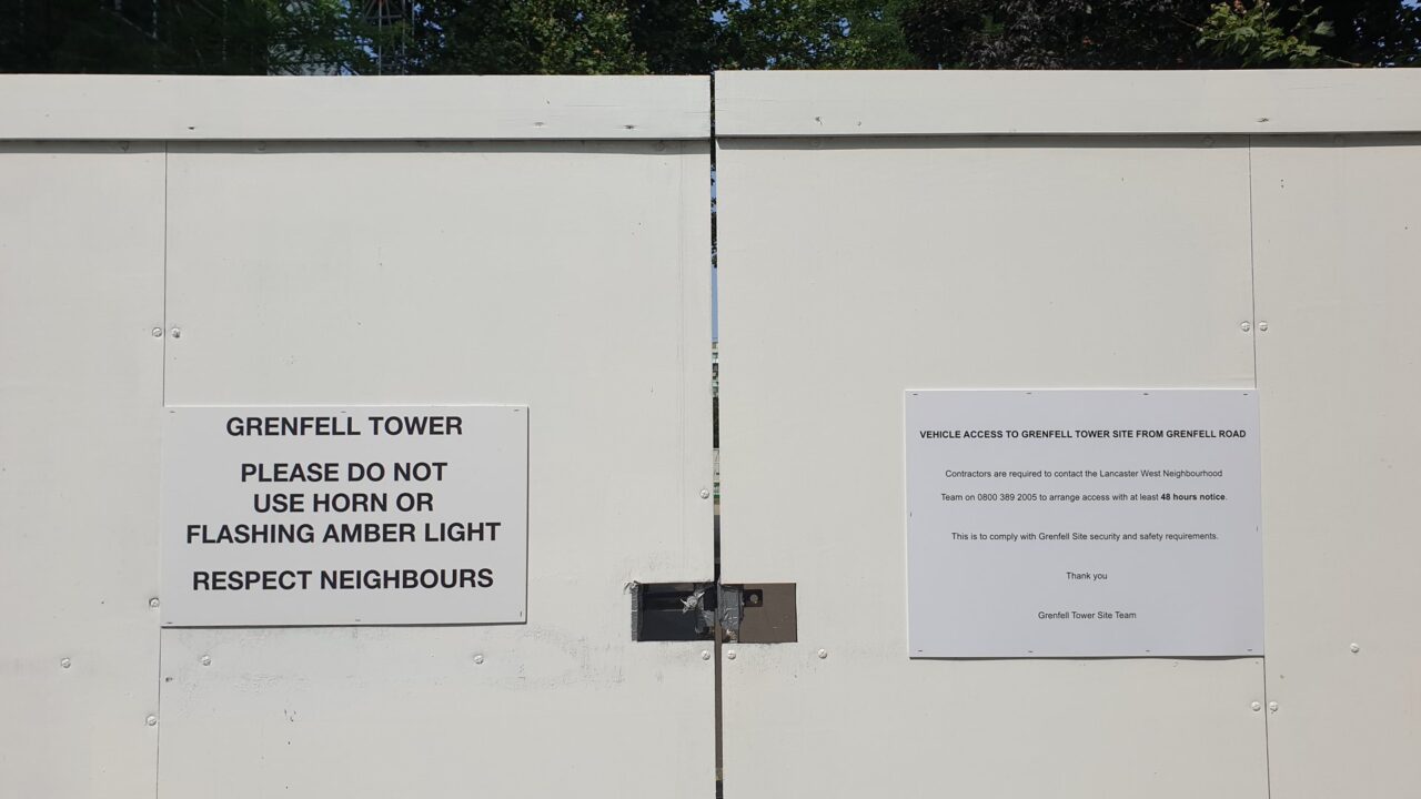 Grenfell Tower, a charred high-rise residential building in London, photographed during daylight.