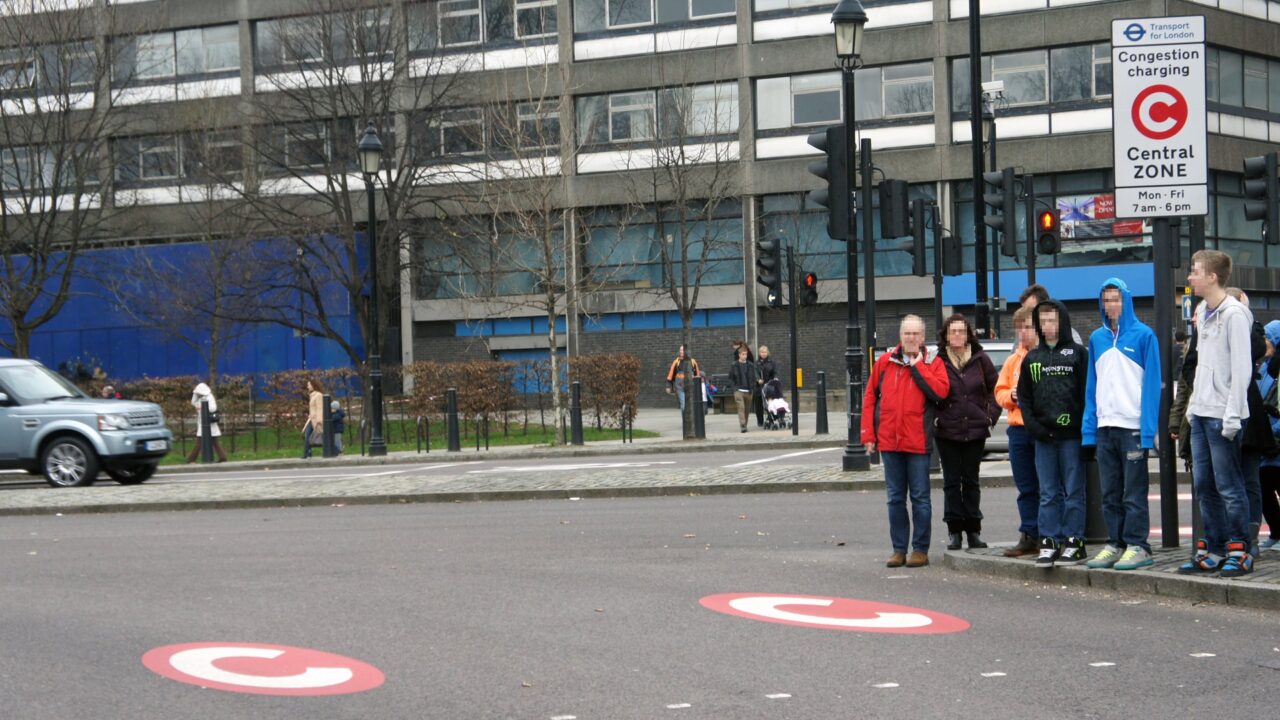 Vertical and horizontal signs marking the Tower Hill entrance to London's Congestion Charge Zone