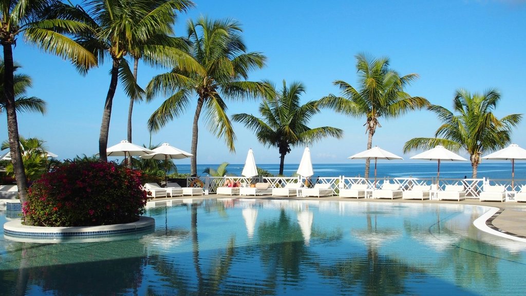 A beachside resort with pool overlooking the ocean in Mauritius