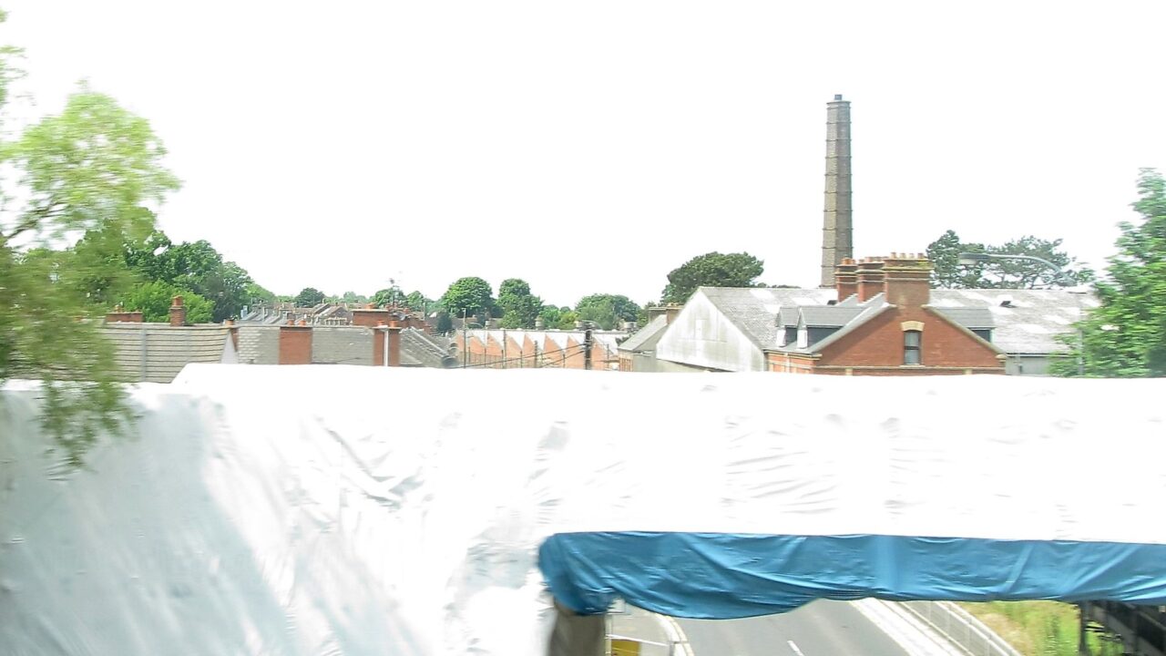 Railway bridge wrapped in protective coverings on Garvaghy Road in Portadown, Northern Ireland