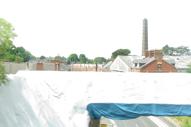 Railway bridge wrapped in protective coverings on Garvaghy Road in Portadown, Northern Ireland
