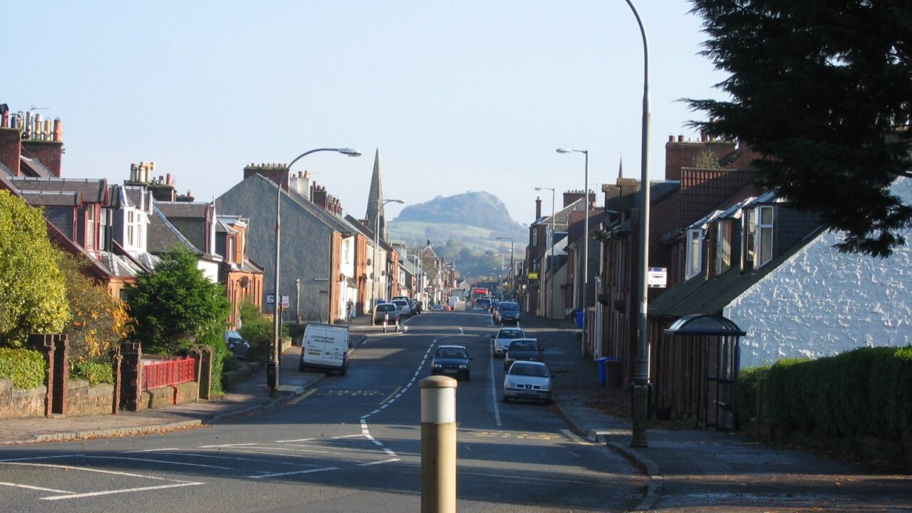 A scenic view of Darvel village in Ayrshire, Scotland, with Loudoun Hill visible in the background.