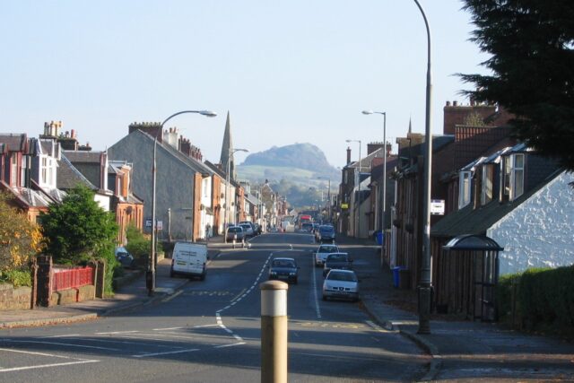 A scenic view of Darvel village in Ayrshire, Scotland, with Loudoun Hill visible in the background.
