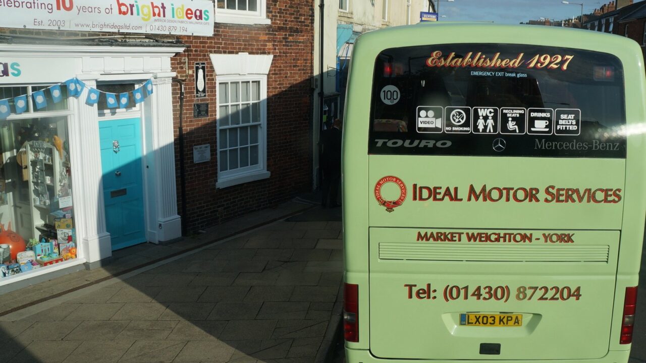 Ideal Motor Services coach parked on York Road, a passenger transport vehicle
