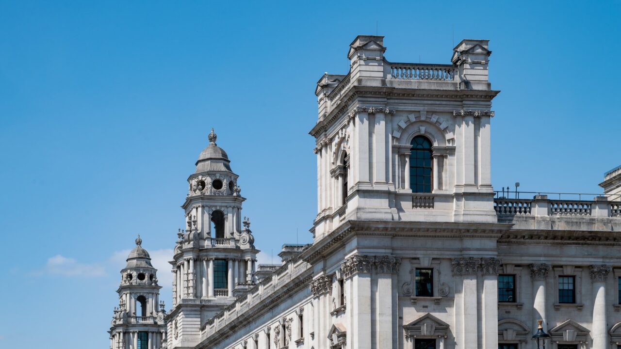 The HM Treasury building on Whitehall, London, a classical stone government office building.
