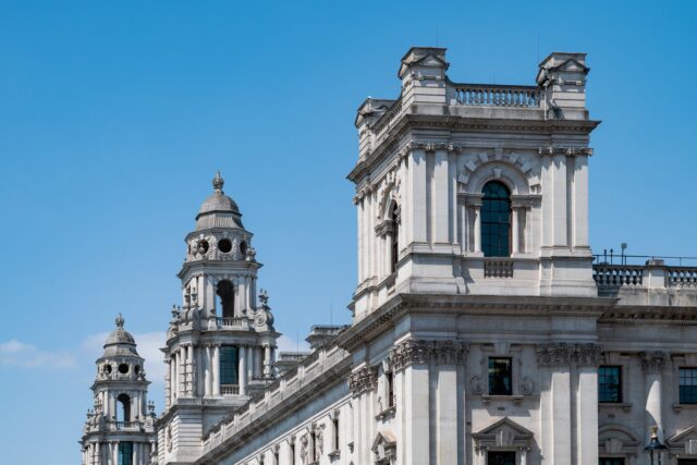 The HM Treasury building on Whitehall, London, a classical stone government office building.