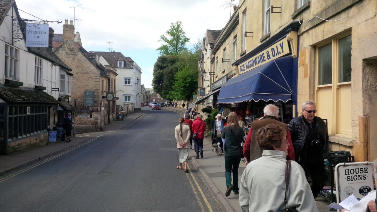 Winchcombe High Street with shops and pedestrians during daytime