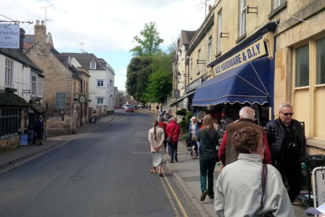 Winchcombe High Street with shops and pedestrians during daytime