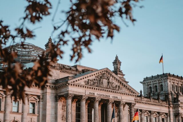The Reichstag building in Berlin photographed during daytime under clear sky